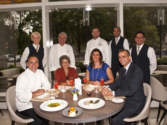 (Bottom row, left to right) World-renowned chef Jean-Georges Vongerichten, Lincoln Square BID President Monica Blum, Trump International General Manager Suzie Mills and Jean-Georges Director of Operations Philippe Vongerichten were joined by La Boite en Bois Owner/Chef Gino Barbuti (top row, second from left) and Boulud Sud Executive Chef Aaron Chambers (top row, third from left.)                                           